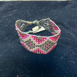 Wide band made with beads. New!